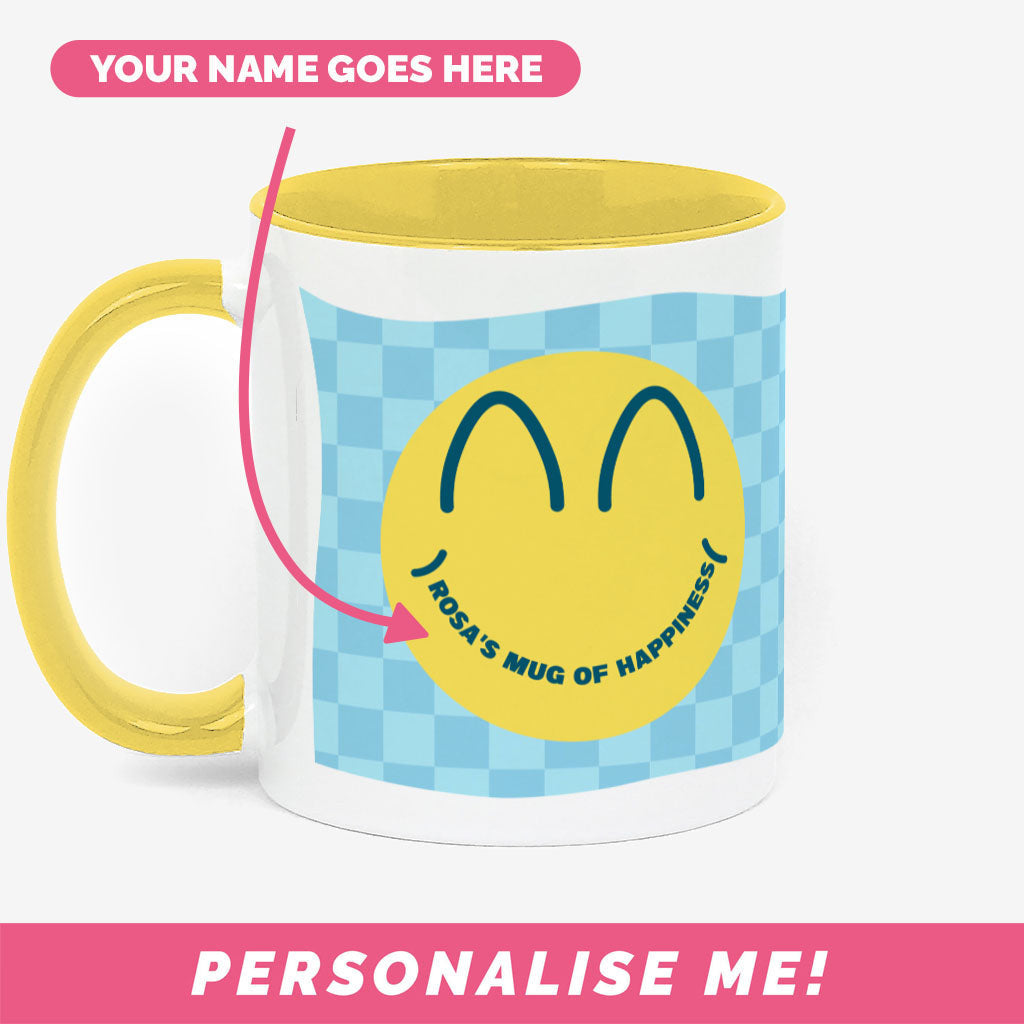 Cute coffee mug with smiley face design and personalised text.