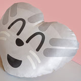 Side view of this heart shaped cushion with a cat's face on the front.