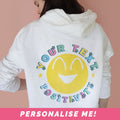 Happy hoodie back with yellow smiley face design and personalised text.