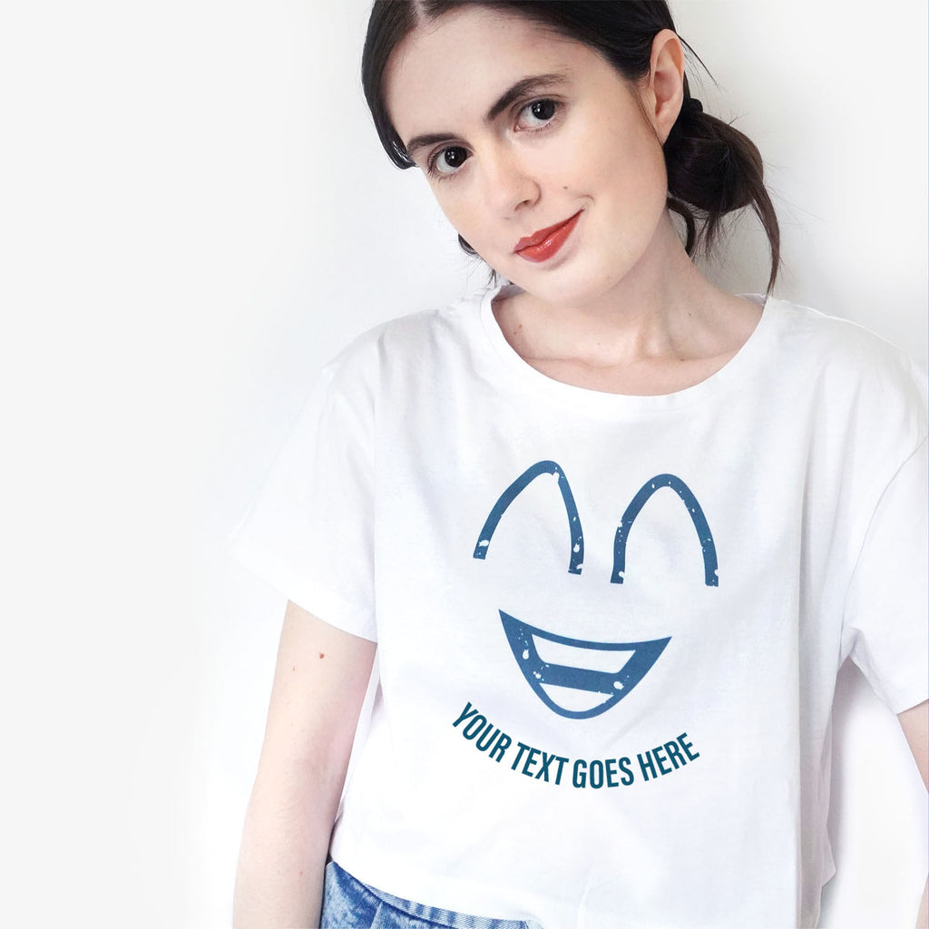White crop t shirt with a cartoon smiley face and space to add your own text.