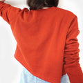 Back of the cropped sweatshirt in red - plain back